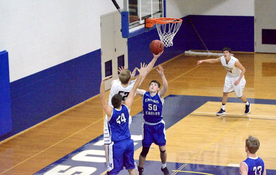 Joshua Friesen attacking the rim during a Judson University game